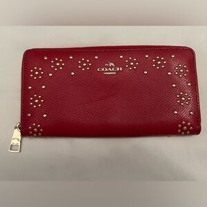 Red studded leather coach wallet